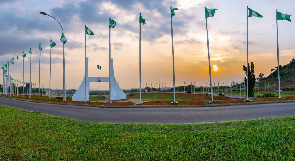 The Significance of Abuja to the Nigerian Nation 2 Abuja city gate with National flags