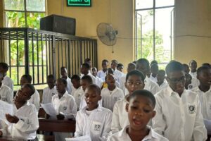 Choristers singing in the chapel of Saints Simon and Jude Seminary