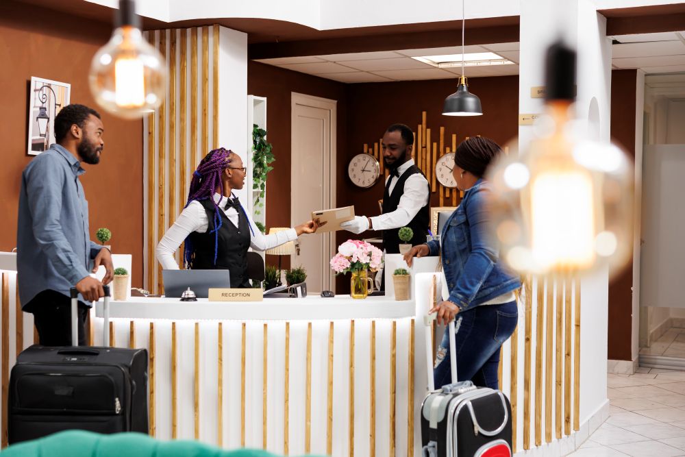 Top Hotels in Abuja 2 front desk staff managing guest checkin